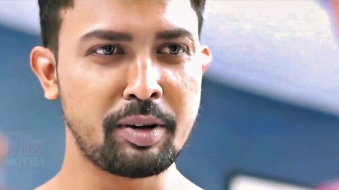 Handsome bearded South Asian man with intense gaze and parted lips close-up