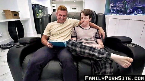 Stepdad cuddles young stepson on couch reading book in gay taboo daddy roleplay
