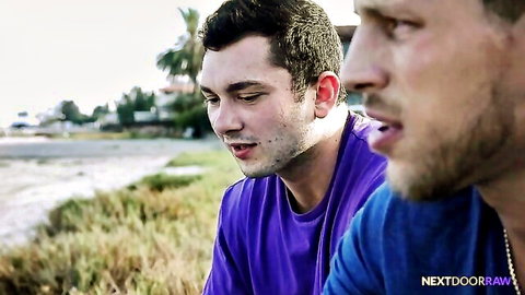 Roman Todd and Riley Mitchel in intense outdoor gaze, tattooed hunks in purple shirts