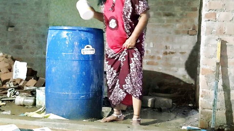 South Asian MILF in saree lifts dress flashing thighs and bare feet by blue drum