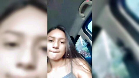 Sexy South Asian girl smirking in car wearing tight tank top teasing viewers