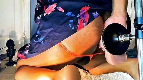 Ebony babe with big ass exposes pussy to black suction cup dildo on fucking machine in floral dress