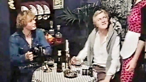Vintage retro blondes foursome toasting drinks at checkered table in bar