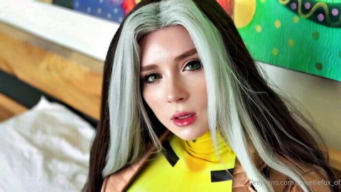 Busty young cosplay babe with split black and silver hair flaunting huge tits in tight yellow top
