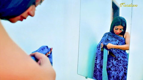Indian bhabhi in blue saree adjusting pallu in mirror, teasing before anal with husband