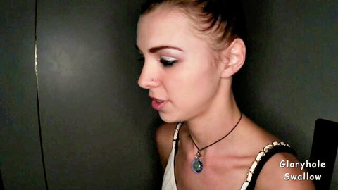 Brunette in profile view at glory hole with open mouth ready for cum swallow
