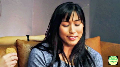 Mia Li smiling casually in blue top, helping through breakup