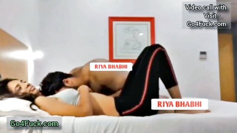 Sexy Indian Riya Bhabhi spooned intimately by shirtless hunk in tight leggings on bed