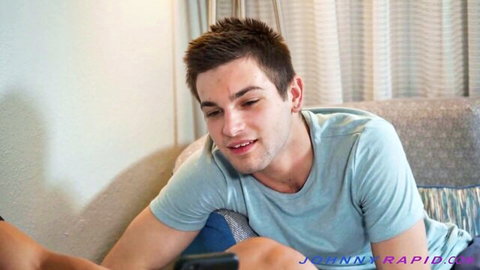 Johnny Rapid smiling in casual t-shirt, hot gay threesome star