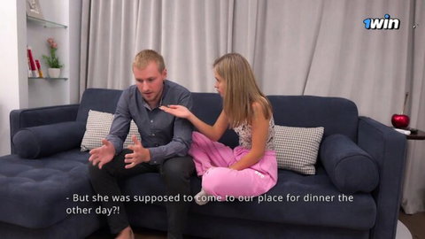 Blonde hotwife and stepbro chat intimately on couch in casual wear