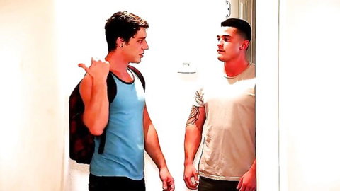 Two muscular tattooed men in tank top and t-shirt, casual intimate chat