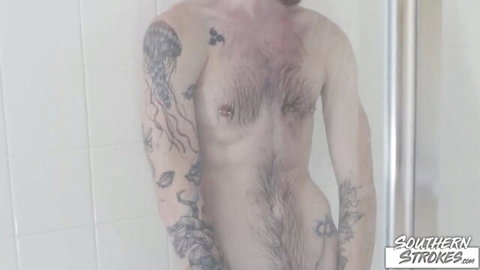 Tattooed hairy guy posing shirtless in mirror, kinky solo tease