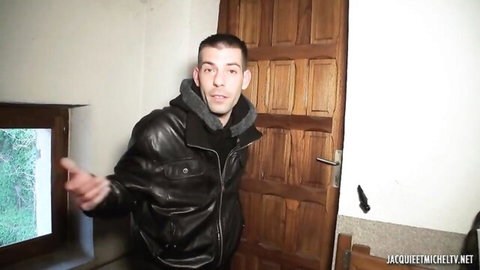 French guy in leather jacket gesturing in Mariza's threesome scene