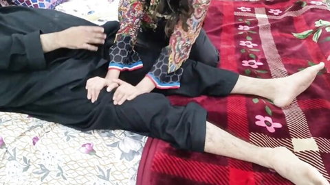 South Asian wife in salwar kameez gropes husband's thighs near cock on bed