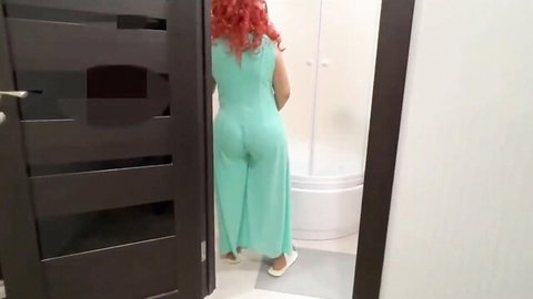 Redhead in tight sheer green dress showing juicy ass in bathroom voyeur view