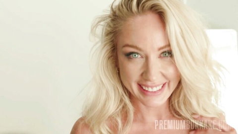 Sadie Summers blonde MILF smiling seductively in adult video thumbnail
