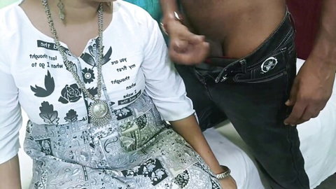 Indian woman in salwar kameez faces hard cock protruding from man's unzipped jeans