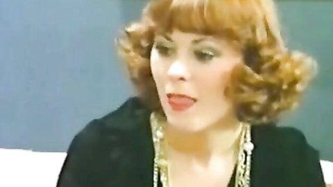Seductive redhead in black top and gold necklace for BBC adventure