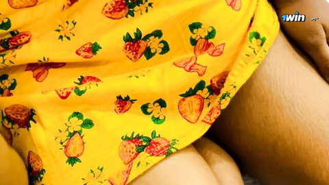 Southeast Asian babe in strawberry yellow dress spreading thighs teasing smooth legs
