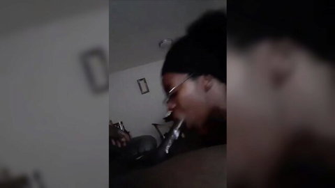 Ebony babe with glasses slurping thick black cock in blurry homemade blowjob