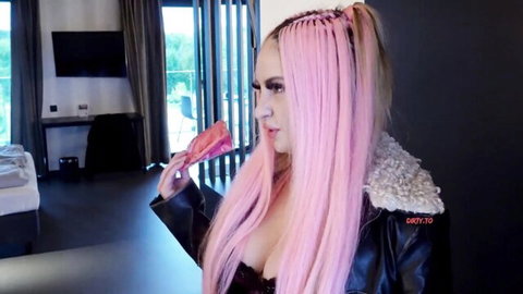 Pink-haired Maria-Gail in leather jacket and lace top seductively bites food in hotel room
