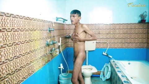 Skinny young Indian teen naked in bathroom posing nude near shower and toilet with visible cock