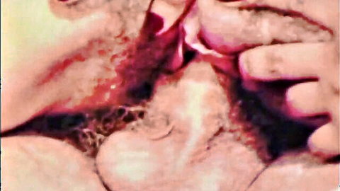 Vintage bearded man gives oral sex to woman in swinging sixties threesome