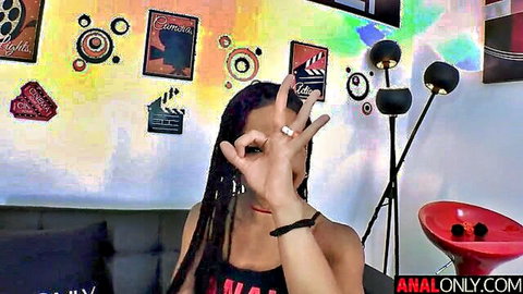 Kira Noir teases with OK gesture in tight tank top, ebony anal star