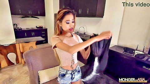 Slim Thai spinner teen in lace top and denim shorts holding stockings