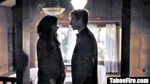 Shadowy intimate moment between young brunette reporter and blond psycho guy