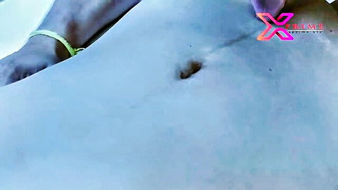 Close-up of sexy Indian girl's smooth belly and pierced navel teasing viewers