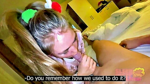Blonde stepdaughter in pigtails performs cunnilingus on woman while man watches