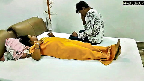 Hot Indian MILF aunty lying with inexperienced young boy on bed