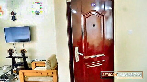 Empty African hotel room door number 27 with TV and furniture before wild ebony pussy fucking