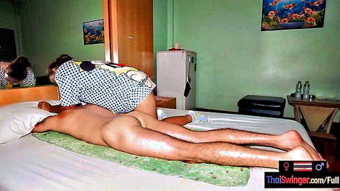 Thai BBW Asian MILF gives client erotic sex massage on bed