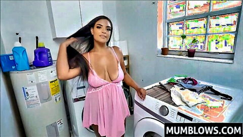 Busty Latina MILF in sheer pink lingerie exposing huge tits and nipples in laundry room
