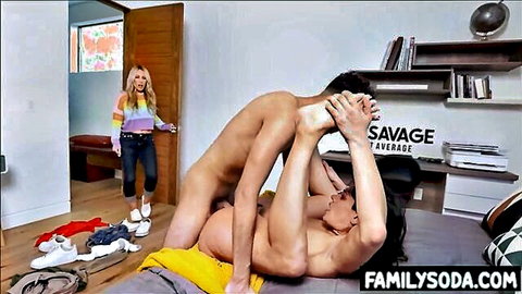 Muscular naked guy fucks brunette's pussy missionary on bed while blonde MILF watches from door