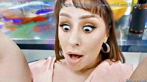 Tommy King with wide-eyed surprise in pink top, Brazzers oily anal scene thumbnail
