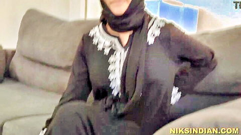 Indian woman in embroidered burqa sitting on couch, ass licked by husband's friend