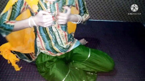 Desi teen in green salwar kameez and yellow dupatta sitting seductively