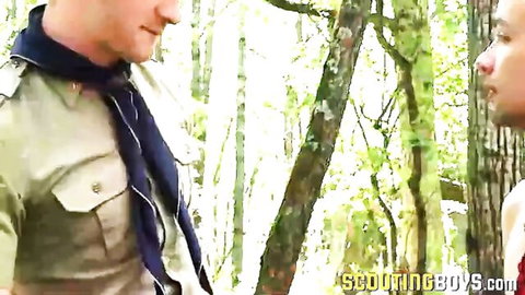 Cole in scout uniform gets close in the woods with partner