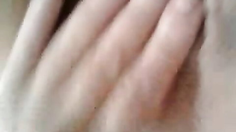 Close-up of pale fingers spreading and fingering wet shaved pussy solo