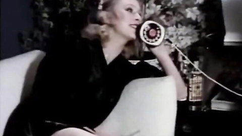 Vintage blonde in black dress seductively on retro phone, natural tits tease - Expo Film