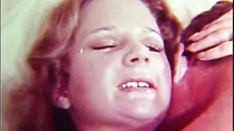 Vintage redhead country girl ecstatic face during cowgirl ride in classic XXX film
