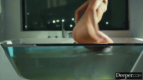 Alexis naked in green bathtub, back view showing round ass, submissive desires