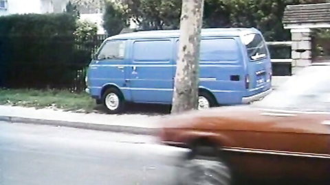 Retro blue van parked on street in vintage German lesbian group sex scene