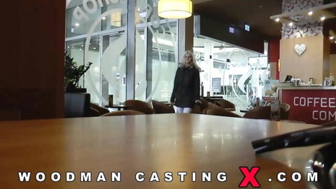 Joleyn Burst in Woodman CastingX coffee shop scene, blonde model standing clothed