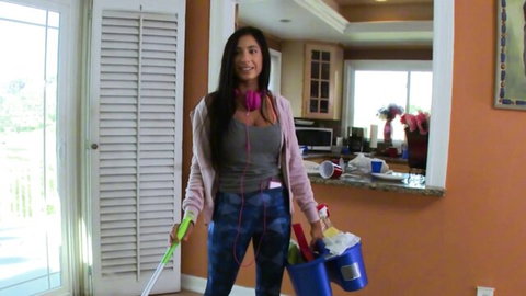 Stacy Jay as sexy Latina maid in tight leggings and top, cleaning tease