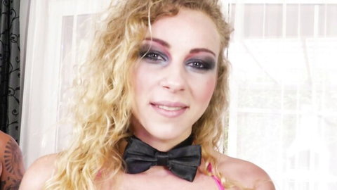 Angel Emily French babe in sexy bowtie and pink top smiling seductively