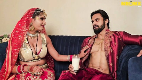 Desi bride in red saree seduces muscular groom with milk glass on honeymoon
